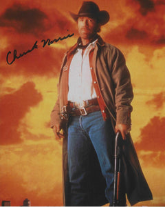 Chuck Norris 10x8 signed in Black Texas Walker Ranger
